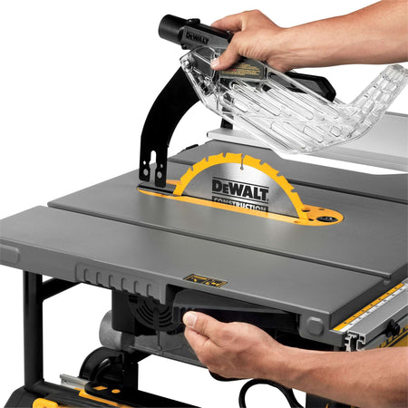 Lifting the clear blade guard off the riving knife using the Site-Pro tool-free release lever on the DeWalt DWE7491RS.