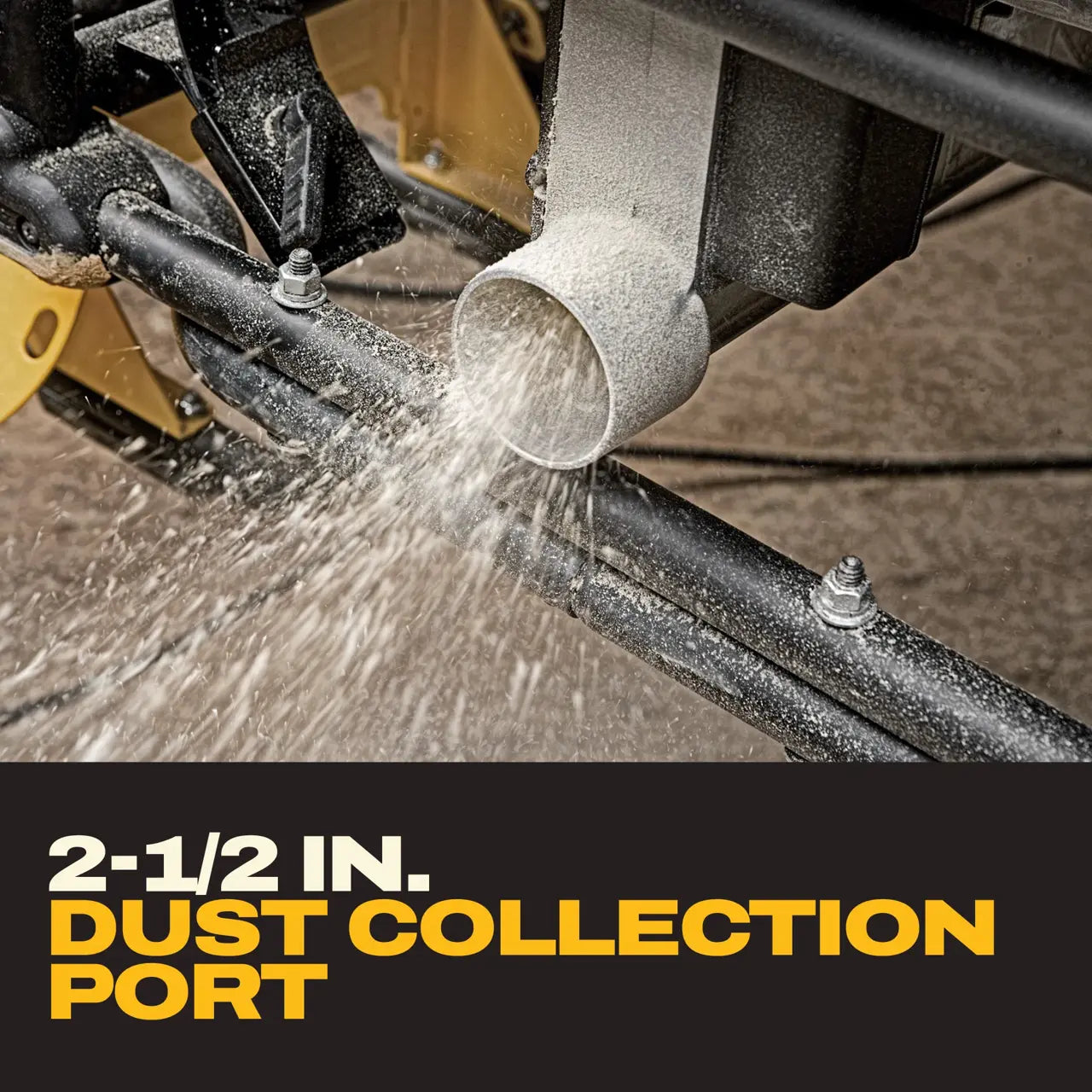 Close-up of sawdust ejecting from the 2-1/2-inch dust collection extraction port beneath the DeWalt DWE7491RS table saw.