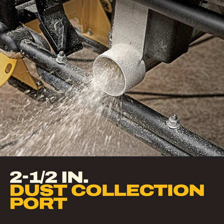 Close-up of sawdust ejecting from the 2-1/2-inch dust collection extraction port beneath the DeWalt DWE7491RS table saw.