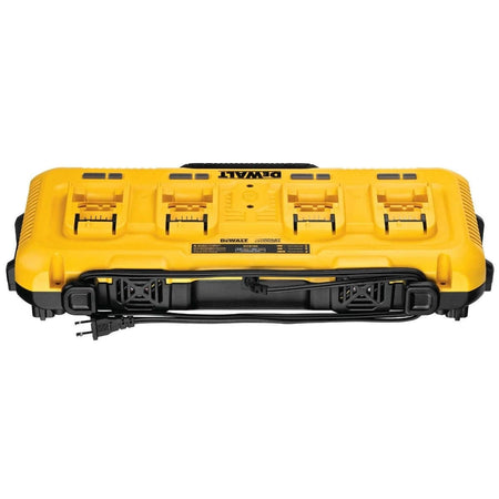 A front-view studio shot of the Dewalt DCB104 4-port charger station, showing the power cord wrapped around the base and the four empty battery charging bays with their respective indicator lights.