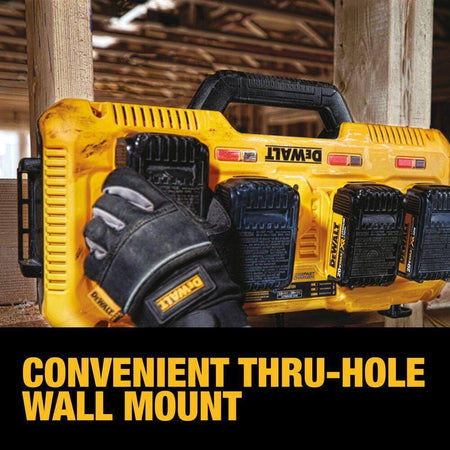 A close-up action shot showing the Dewalt DCB104 charger mounted vertically to a wooden wall stud, labeled Convenient Thru-Hole Wall Mount.