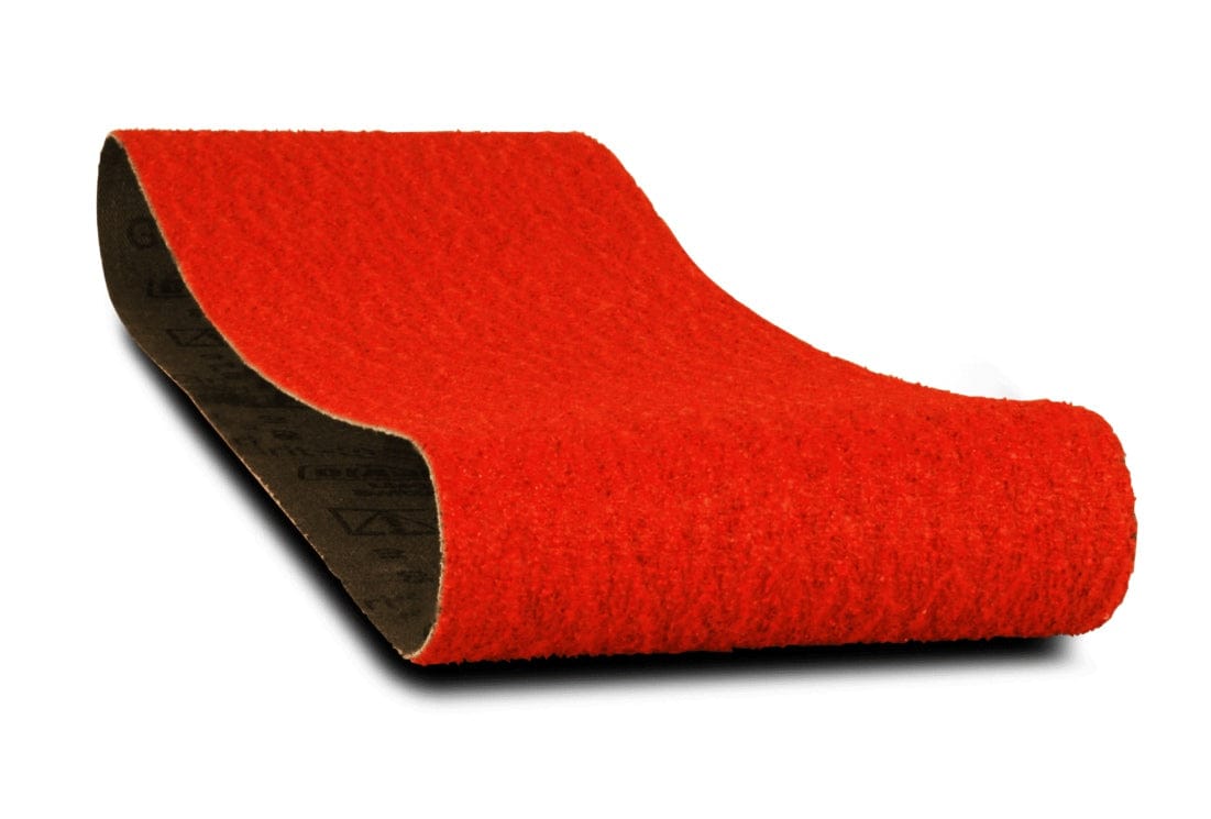 Close-up of a single Diablo 4 x 24 inch red sanding belt, curved to show the coarse abrasive surface and the black cloth backing.