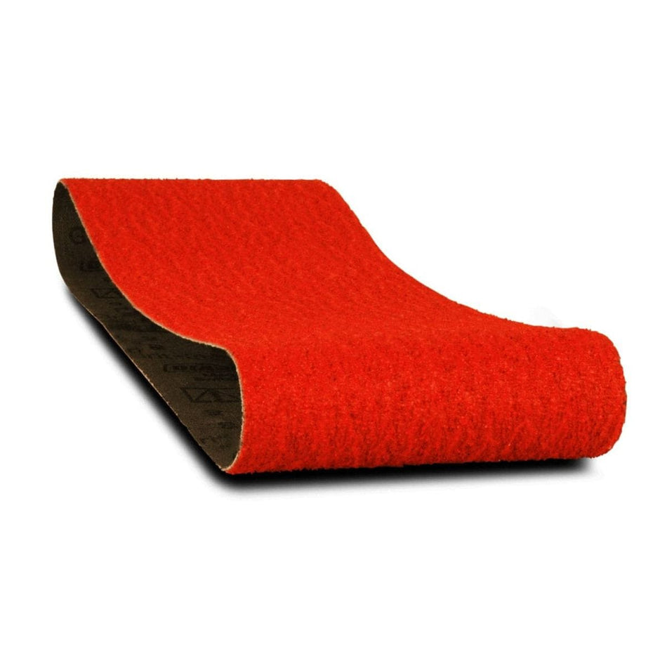 Close-up of a single Diablo 4 x 24 inch red sanding belt, curved to show the coarse abrasive surface and the black cloth backing.
