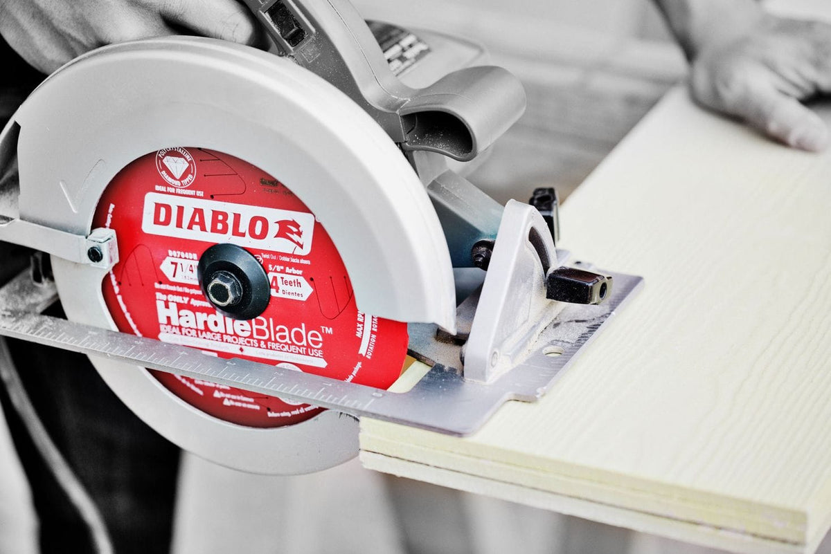 Close-up of Diablo HardieBlade saw cutting light-colored wood; 7-1/4 inch blade with 4 teeth in active use.