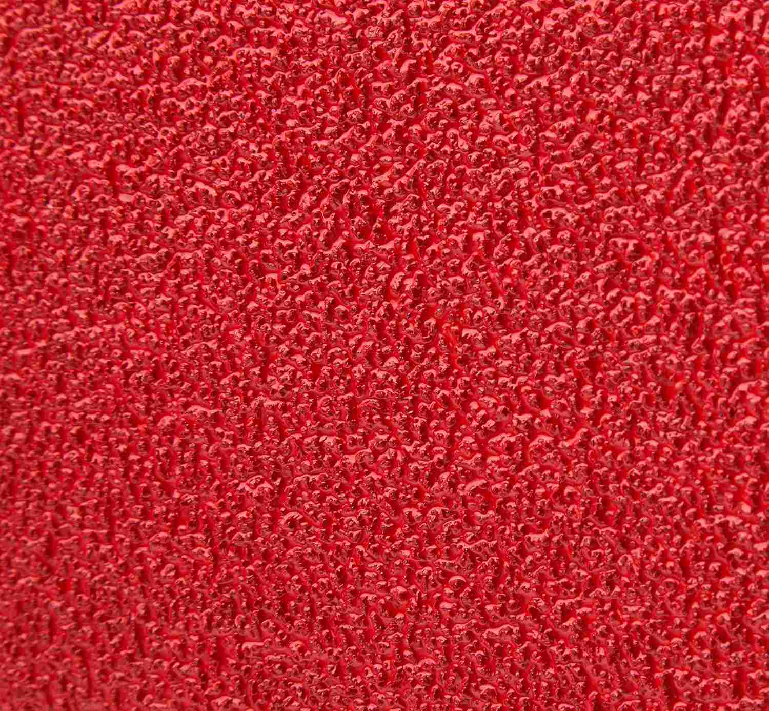 Macro close-up of the Diablo 36 grit zirconium abrasive grain showing the ultra-coarse texture designed for rapid material removal and Clog-SHIELD loading resistance.