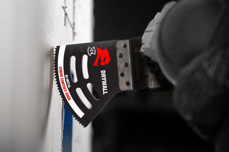 Action shot showing the Diablo DOU200RBD oscillating blade attached to a multi-tool, making a precise plunge cut into a sheet of drywall.