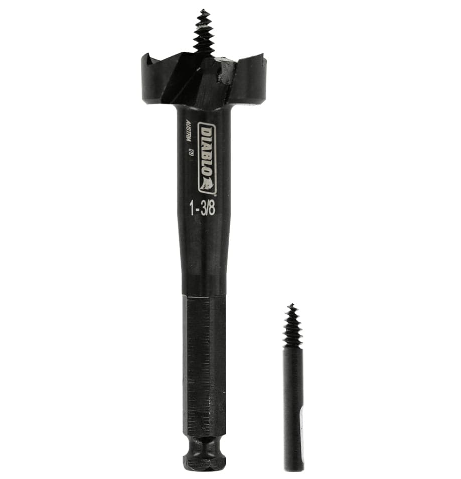 Studio shot of the black Diablo 1-3/8 inch self-feed bit standing upright with a replacement feed screw next to the hex shank.