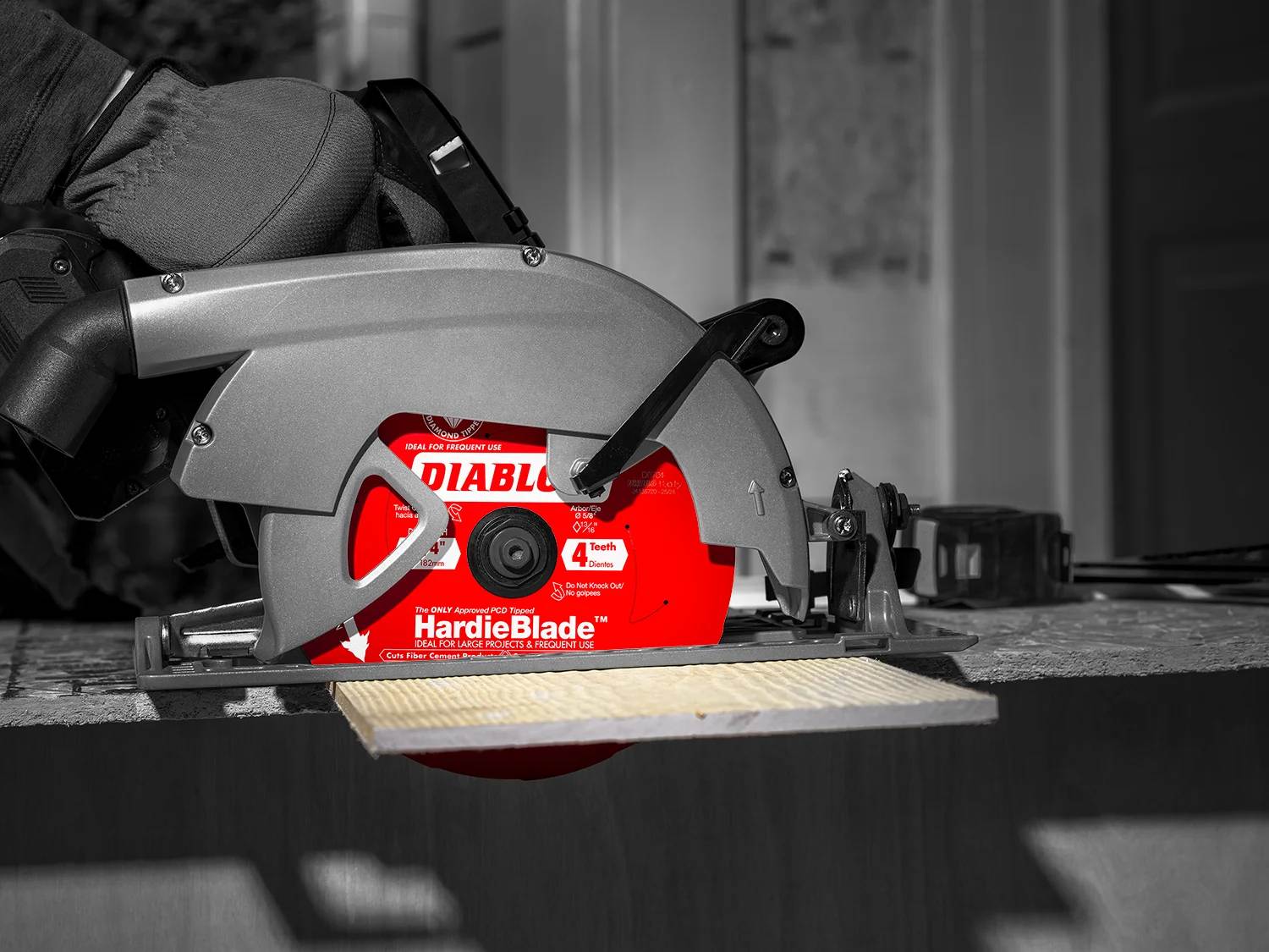 Angled close-up view of the Diablo D0704DHA saw blade showing the detailed alignment of the anti-vibration laser-cut stabilizers, stabilizing vents, and a Polycrystalline Diamond (PCD) tipped tooth for extreme cutting life.