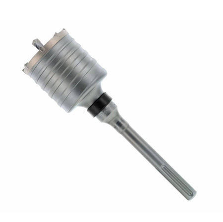 3-1/4 inch bit. This is a close-up, eye-level shot of a large, gray core drill bit, angled slightly to the right against a plain white background. The bit features a wide, cylindrical cutting head with horizontal grooves and sharp teeth, which tapers down to a narrower, smooth shaft with a black collar and a rectangular attachment point at the end.