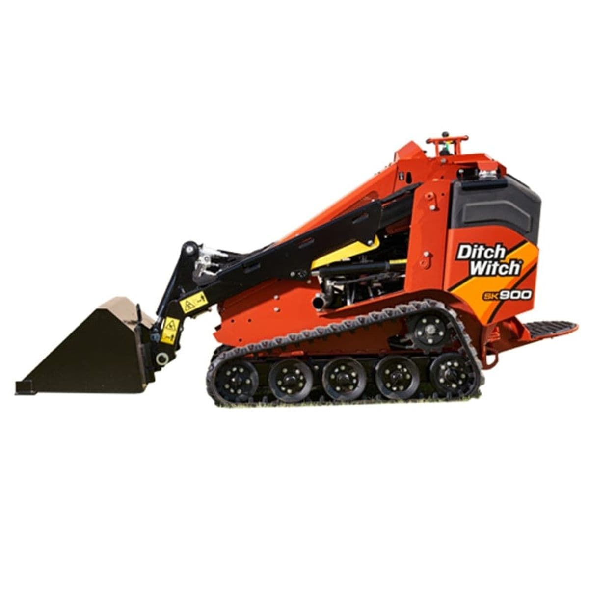 Compact Ditch Witch SK900 mini skid steer loader parked on a job site, featuring rubber tracks, front-mounted bucket, and hydraulic arms; designed for landscaping, construction, and tree care tasks. Branding is visible on the side of the machine.