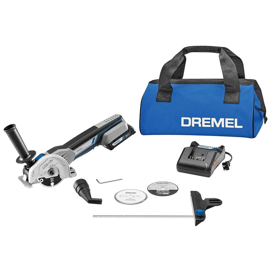 A studio shot of the complete Dremel US20V Ultra-Saw kit, including the tool, battery, charger, blue storage bag, edge guide, dust port, and cutting wheels.