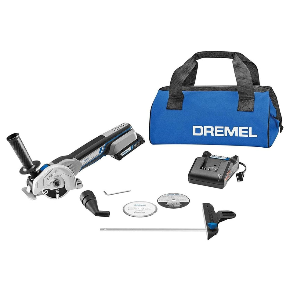 The complete Dremel US20V-01 cordless saw kit, including the tool, battery, charger, three cutting wheels, edge guide, dust port, and blue Dremel storage bag.