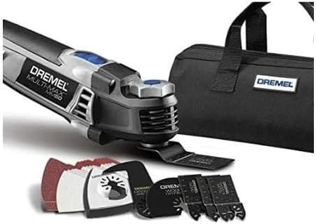 Product shot of the Dremel MM50 oscillating tool with an attached flush cutting blade and the included black Dremel branded soft storage bag for tools and accessories.