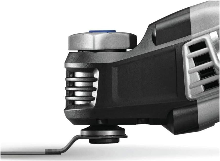 Extreme close-up of the Dremel MM50 front end highlighting the tool-less blade change mechanism and the compact gear housing designed for superior access in tight spaces.