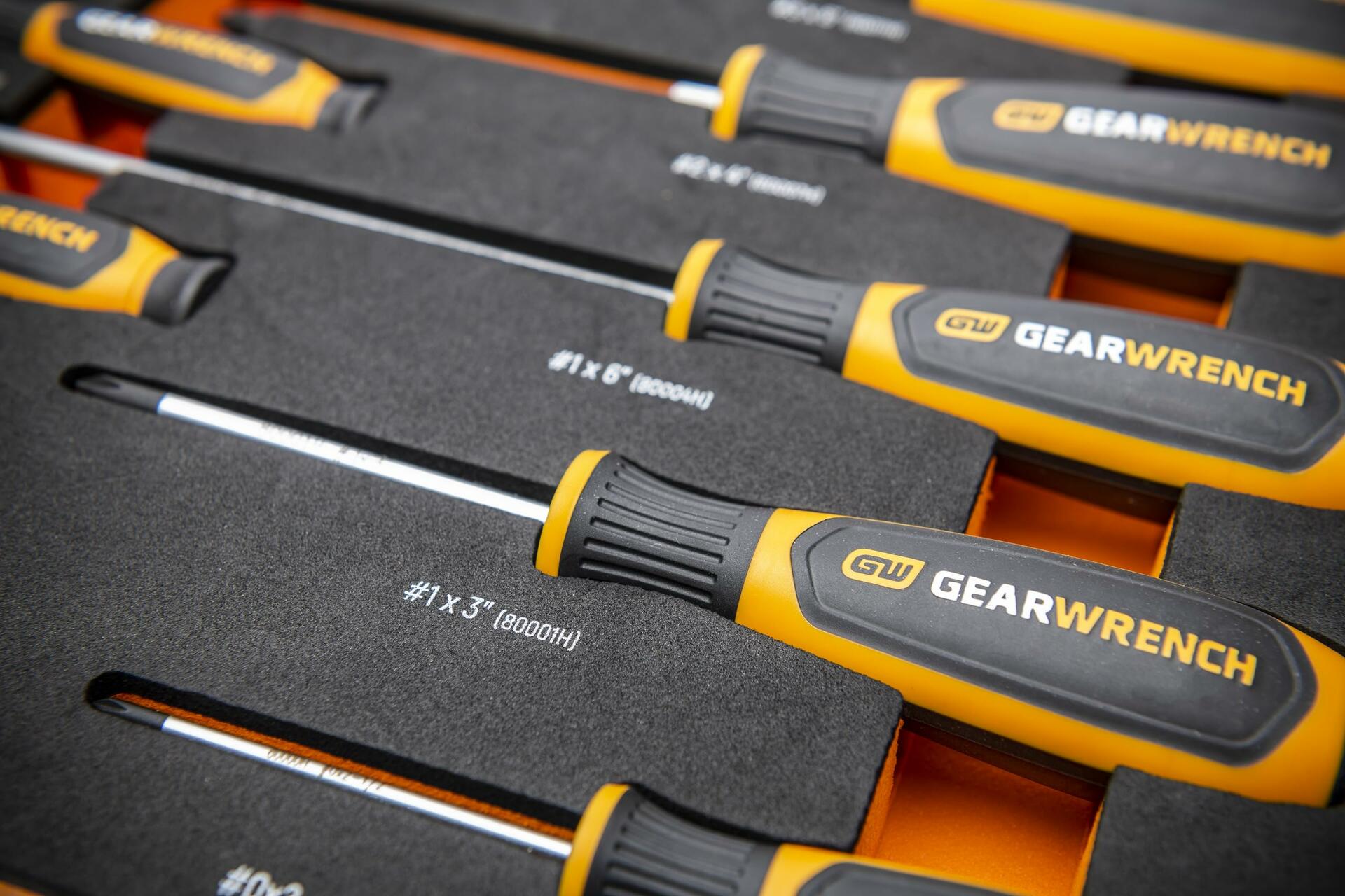 A close-up shot of the GEARWRENCH screwdriver handles in the foam tray, showing the size labels like #1x3" and #1x6".