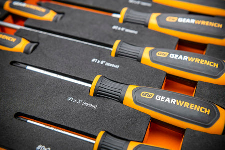 A close-up shot of the GEARWRENCH screwdriver handles in the foam tray, showing the size labels like #1x3" and #1x6".