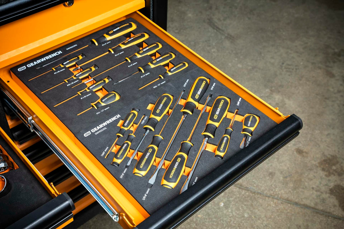 The GEARWRENCH screwdriver foam tray set shown inside an open, orange tool chest drawer, demonstrating its fit as a modular organizer.