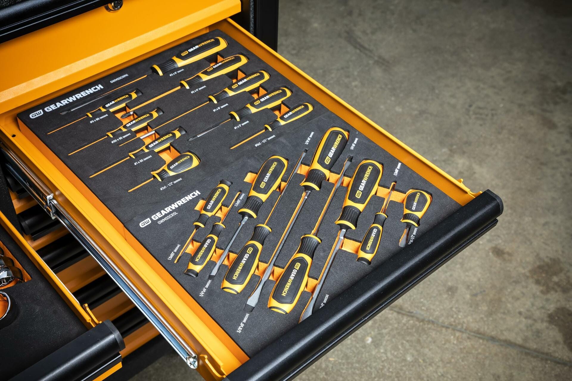 The GEARWRENCH screwdriver foam tray set shown inside an open, orange tool chest drawer, demonstrating its fit as a modular organizer.
