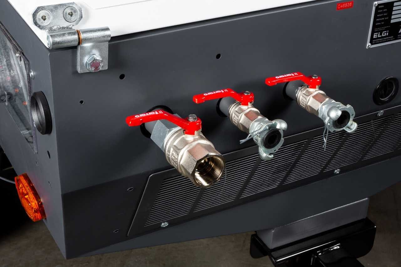 A close-up of the ELGi D185T4F outlet manifold featuring three heavy-duty air discharge valves with red handled ball valves for connecting multiple pneumatic hoses or sandblasting equipment.