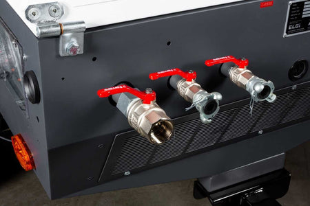 A close-up of the ELGi D185T4F outlet manifold featuring three heavy-duty air discharge valves with red handled ball valves for connecting multiple pneumatic hoses or sandblasting equipment.