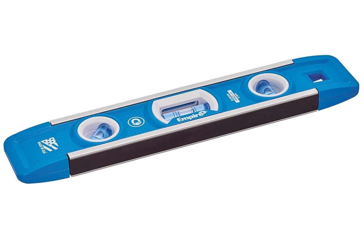 Angled perspective of the torpedo level highlighting the dark magnetic strip on the bottom edge and the V-groove on the top edge for pipe alignment.