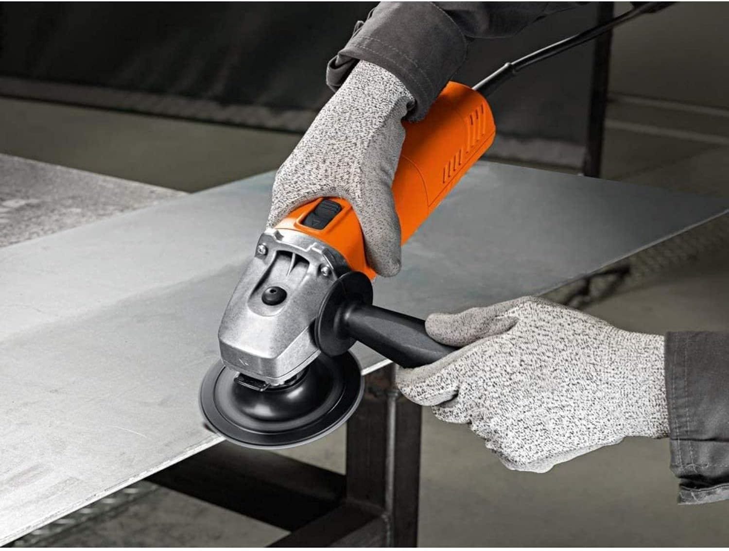 Action shot of the FEIN Angle Grinder being used by a person wearing protective gloves to grind the edge of a large piece of sheet metal.