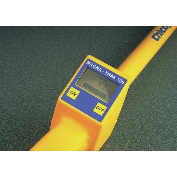 Close-up of CST Berger Magna-Trak 100 magnetic locator showing yellow body, blue control panel, LCD screen, and ON/OFF buttons used for detecting buried ferrous objects.