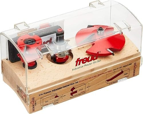 Freud Industrial Router Bit Set in a transparent case with labeled wooden base. Includes three red bits for rail, stile, and raised panel profiles. Text and diagrams identify item 97-150 and cutting applications.