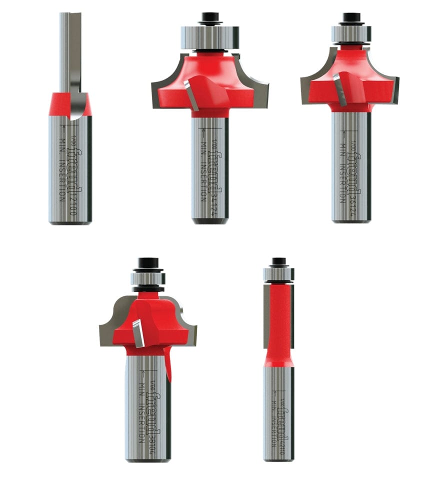 Photo of five Freud router bits arranged side by side. Each bit features a red cutting head and silver shank, with distinct profiles including straight, classical ogee, Roman ogee, round-over, and flush trim. Some bits include bearings for guided cutting. Designed for shaping wood edges in furniture and cabinetry.