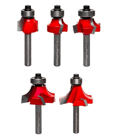 Photo of five Freud router bits arranged in two rows. Each bit features a red-coated cutting head and silver shank, designed for creating round over or beading profiles in woodworking. Text on shanks is partially visible.