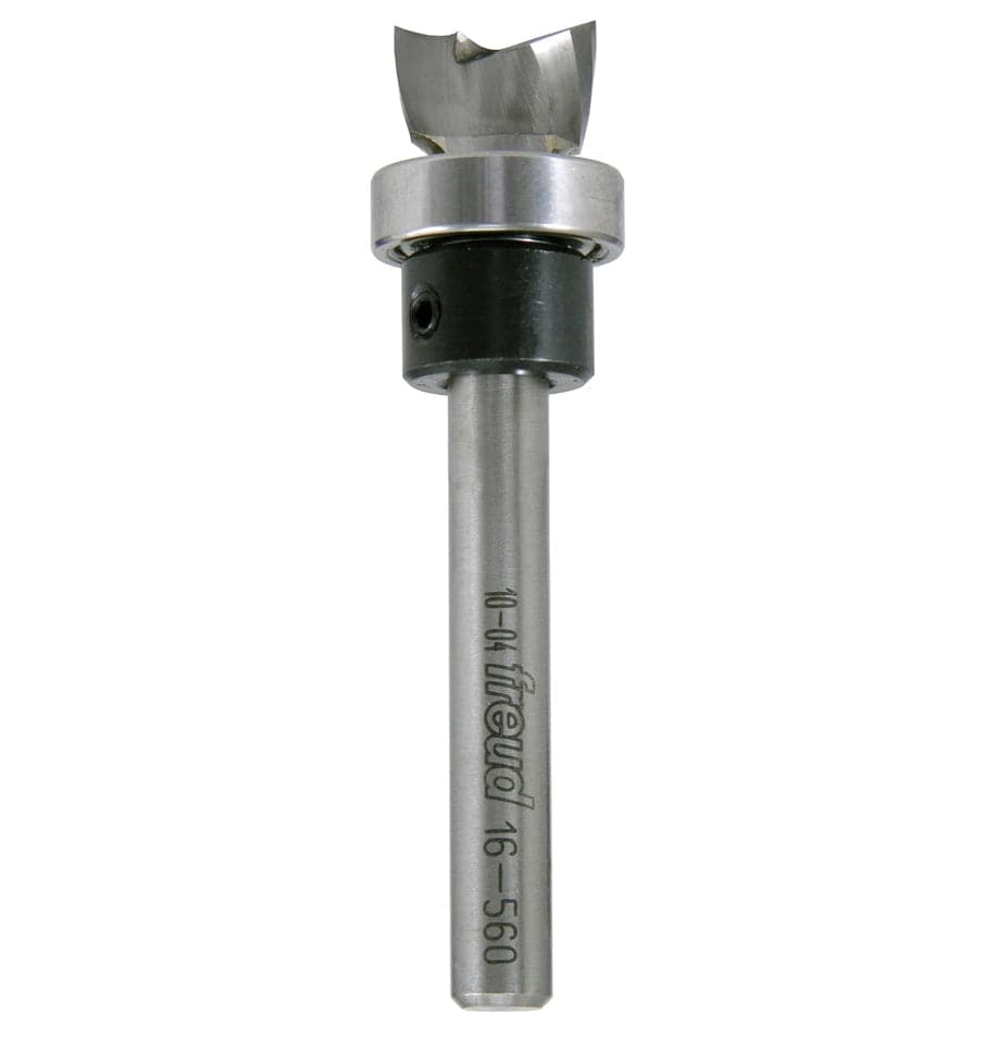 A side-profile view of the Freud 16-560 mortising router bit against a white background, highlighting the 1/4-inch shank and the precision-ground down-shear carbide cutters.
