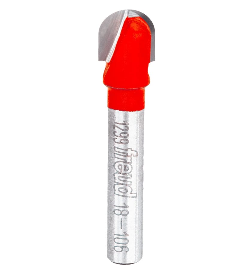 Studio product view of the Freud 18-106 router bit, featuring a 1/4 inch silver shank and a red Perma-SHIELD coated round nose cutting head with a 3/16 inch radius tip.