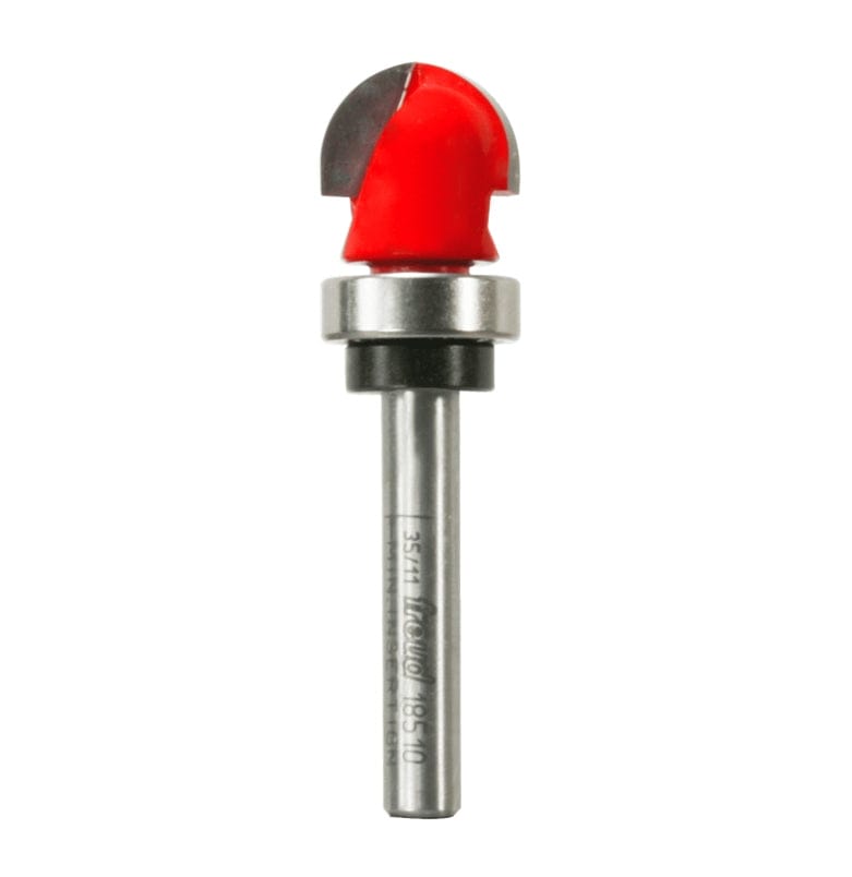 A high-resolution studio photograph of the Freud 18-510 round nose router bit, showcasing its red cutting head with a rounded carbide tip, a top-mounted steel ball bearing for template guidance, and a 1/4 inch polished steel shank.