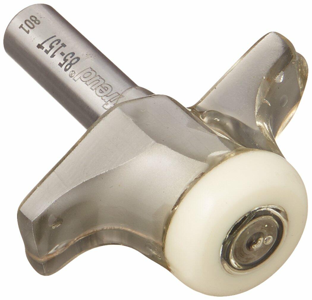 Close-up of the Freud 85-157 round over bowl router bit, showing the carbide cutting edge, the $1/2$ inch shank with engraving, and the white non-marring guide bearing.