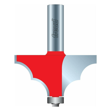 A detailed cross-section illustration of the Freud 85-108 solid surface edge profile router bit, showing the red carbide cutter creating a complex ogee-style decorative edge profile guided by the bottom steel bearing.