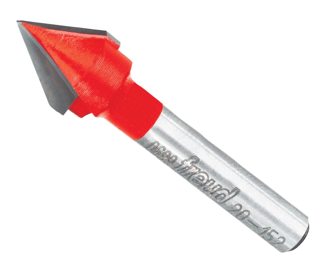 A professional studio product shot of the Freud 20-152 60-degree V-grooving router bit at an angle, showing the sharp carbide cutting head with red Perma-SHIELD coating and a polished 1/4-inch steel shank.