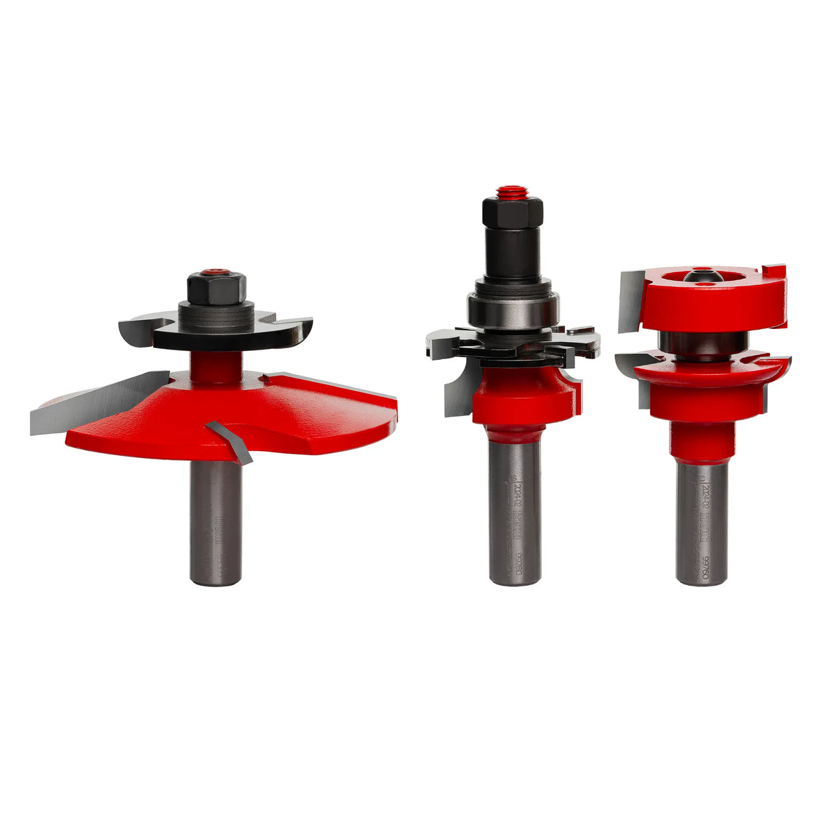 A direct studio product shot of the Freud 97-156 3-Piece Premier Adjustable Cabinet Door Router Bit Set against a clean white background, showcasing the red Perma-SHIELD protective coating, precision-ground micrograin carbide cutting edges, and unpainted 1/2-inch steel shanks with laser-etched minimum insertion lines, arranged left to right as the Quadra-Cut cove raised panel bit with a back-cutter attachment and lock nut, the adjustable cope rail bit with custom spacing shims, and the matching adjustable s