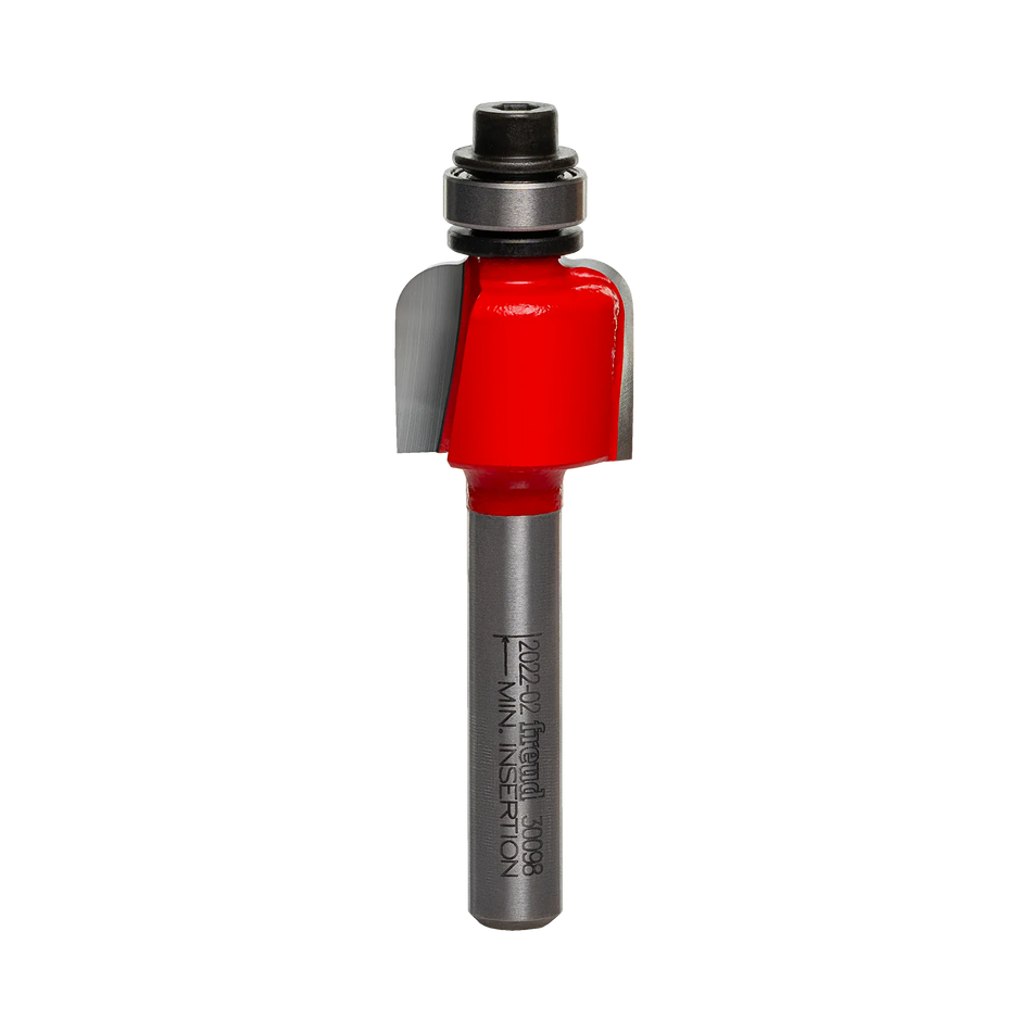 A high-quality studio photograph of the Freud 30-098 cove router bit, showing its red body, sharp carbide cutting edges, top-mounted steel ball bearing, and a 1/4 inch polished shank.