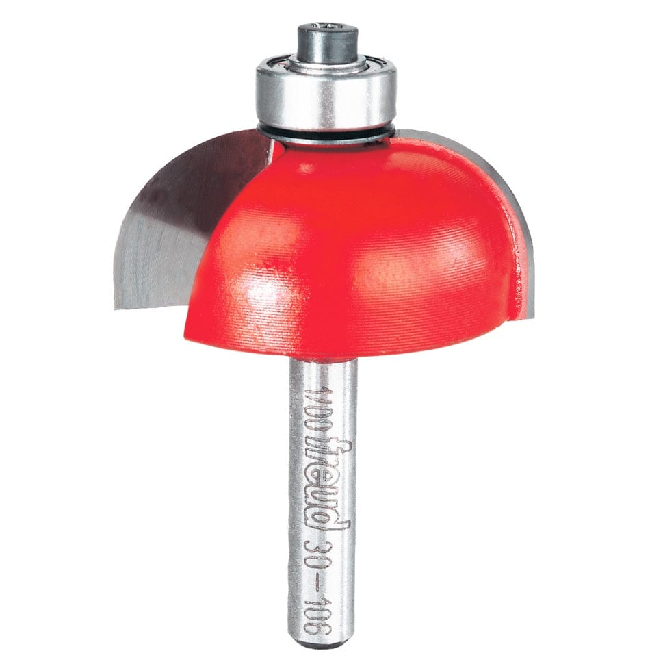 A professional studio product shot of the Freud 30-106 1/2 inch radius cove router bit featuring the signature red coating, a ball-bearing guide, and a polished 1/4 inch steel shank.