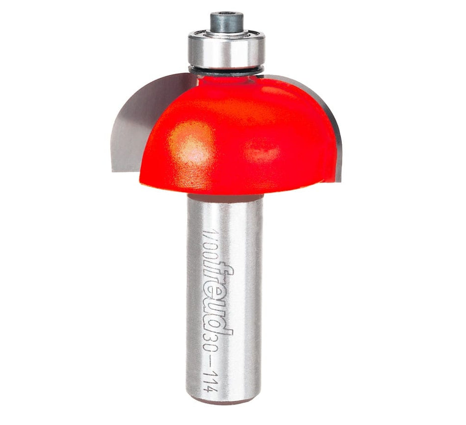 A professional studio photograph of the Freud 30-114 cove router bit, featuring its bright red Perma-SHIELD coating on the cutting head, sharp silver carbide edges, a top-mounted ball bearing pilot, and a polished 1/2 inch steel shank.