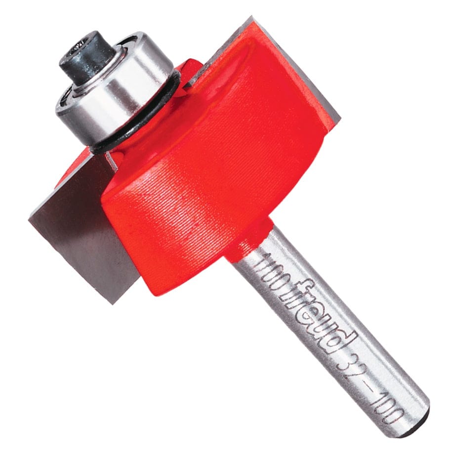 A studio product shot of the Freud 32-100 carbide rabbeting router bit at an angle, featuring the signature red Perma-SHIELD non-stick coating, a ball-bearing guide, and a polished 1/4-inch steel shank.