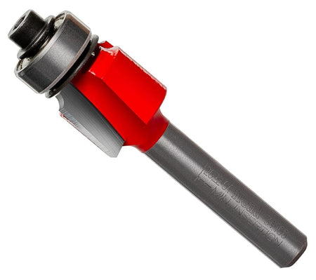 A studio product shot of the Freud 34-100 carbide rounding over router bit at an angle, featuring the signature red Perma-SHIELD non-stick coating, a ball-bearing guide, and a polished 1/4-inch steel shank.