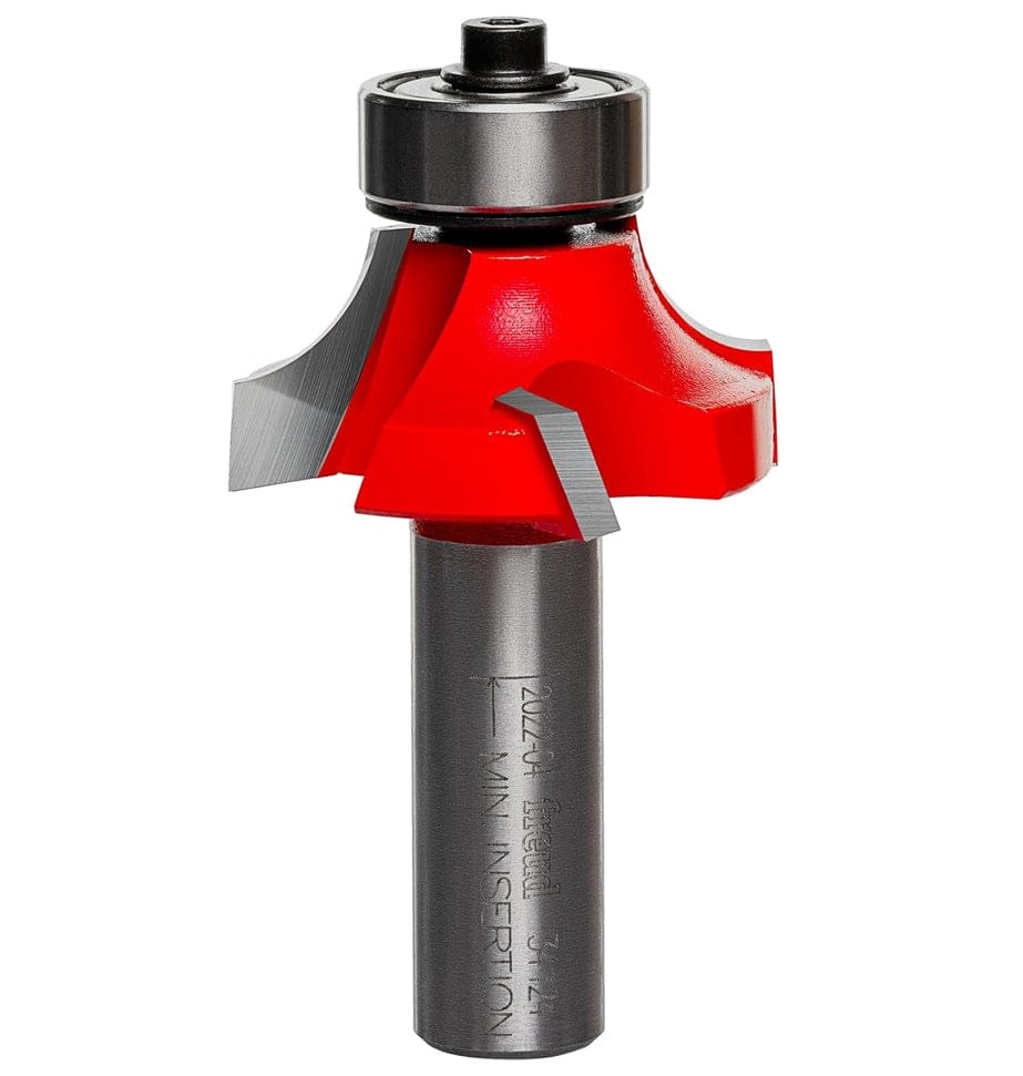 A side-profile view of the Freud 34-124 rounding over bit against a white background, highlighting the Quadra-Cut 4-cutter design and the precision-mounted top ball-bearing guide.