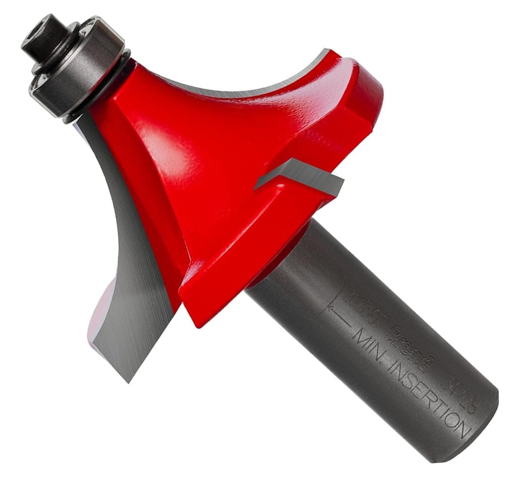 A professional studio product shot of the Freud 34-128 carbide rounding over router bit shown at an angle, featuring the signature red Perma-SHIELD non-stick coating on the cutting head and a polished 1/2-inch steel shank.