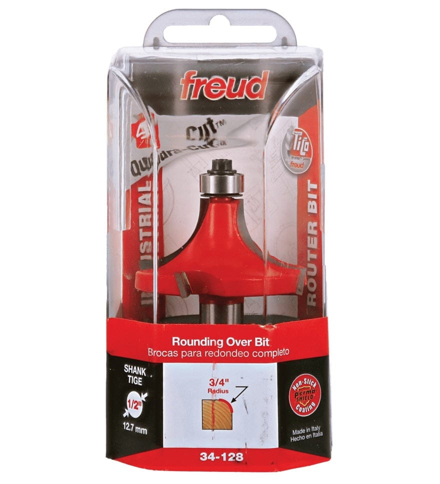 Retail clamshell packaging for the Freud 34-128 industrial rounding over bit, displaying the 3/4-inch radius profile, Quadra-Cut technology logo, and 1/2-inch shank size for heavy-duty woodworking projects.