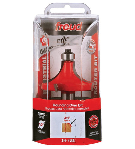 Retail clamshell packaging for the Freud 34-128 industrial rounding over bit, displaying the 3/4-inch radius profile, Quadra-Cut technology logo, and 1/2-inch shank size for heavy-duty woodworking projects.