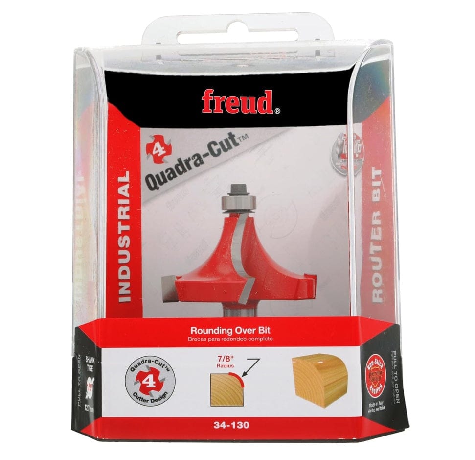 The Freud 34-130 router bit in its retail packaging. The clear plastic case contains a red insert card highlighting the "Quadra-Cut 4 Cutter Design" and "7/8 Inch Radius".