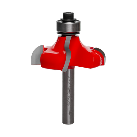 Studio shot of the Freud 38-154 Ogee router bit featuring a red Perma-SHIELD body, four Quadra-Cut carbide cutters, 1/4 inch shank, and ball bearing guide.