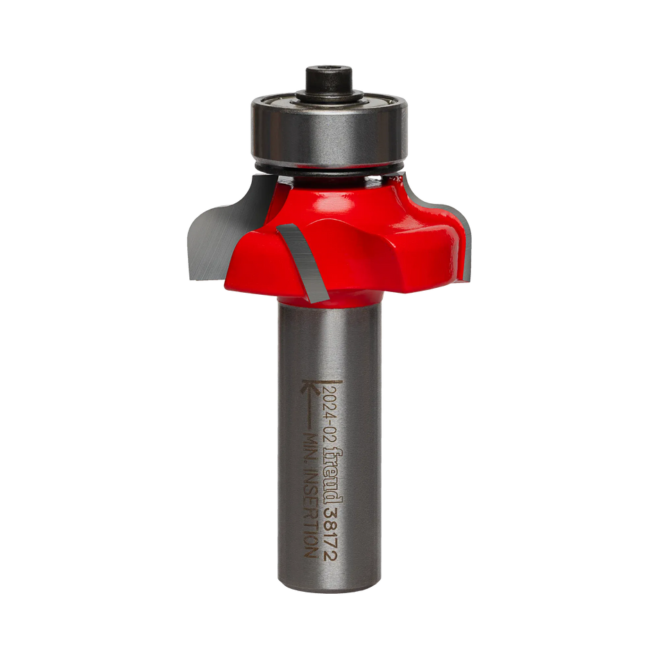 Studio shot of the Freud 38-172 Roman Ogee router bit featuring a red Perma-SHIELD body, four Quadra-Cut carbide cutters, 1/2 inch silver shank, and top bearing guide.