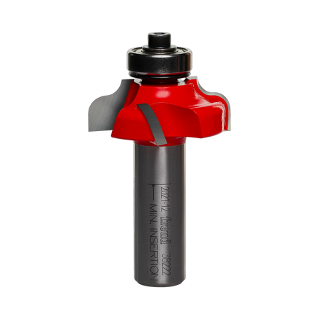 Studio shot of the Freud 38-222 Ogee Fillet router bit featuring a red Perma-SHIELD body, four Quadra-Cut carbide cutters, 1/2 inch silver shank, and top ball bearing guide.